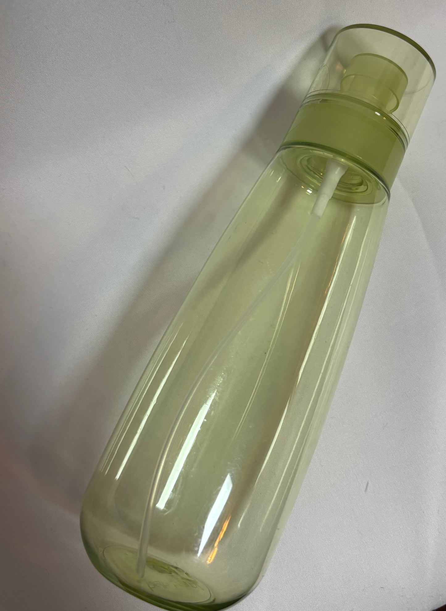 green spray mist bottle
